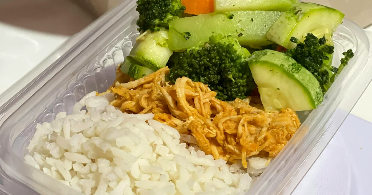 Meal prep lunch box with rice, vegetables, and protein — budget weekly meal prep